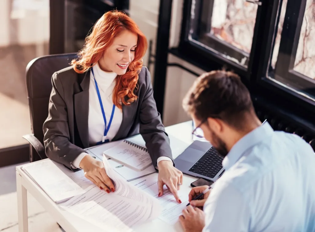Two people reviewing paperwork.