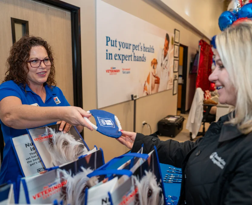 Vet team handing out freebies at grand opening