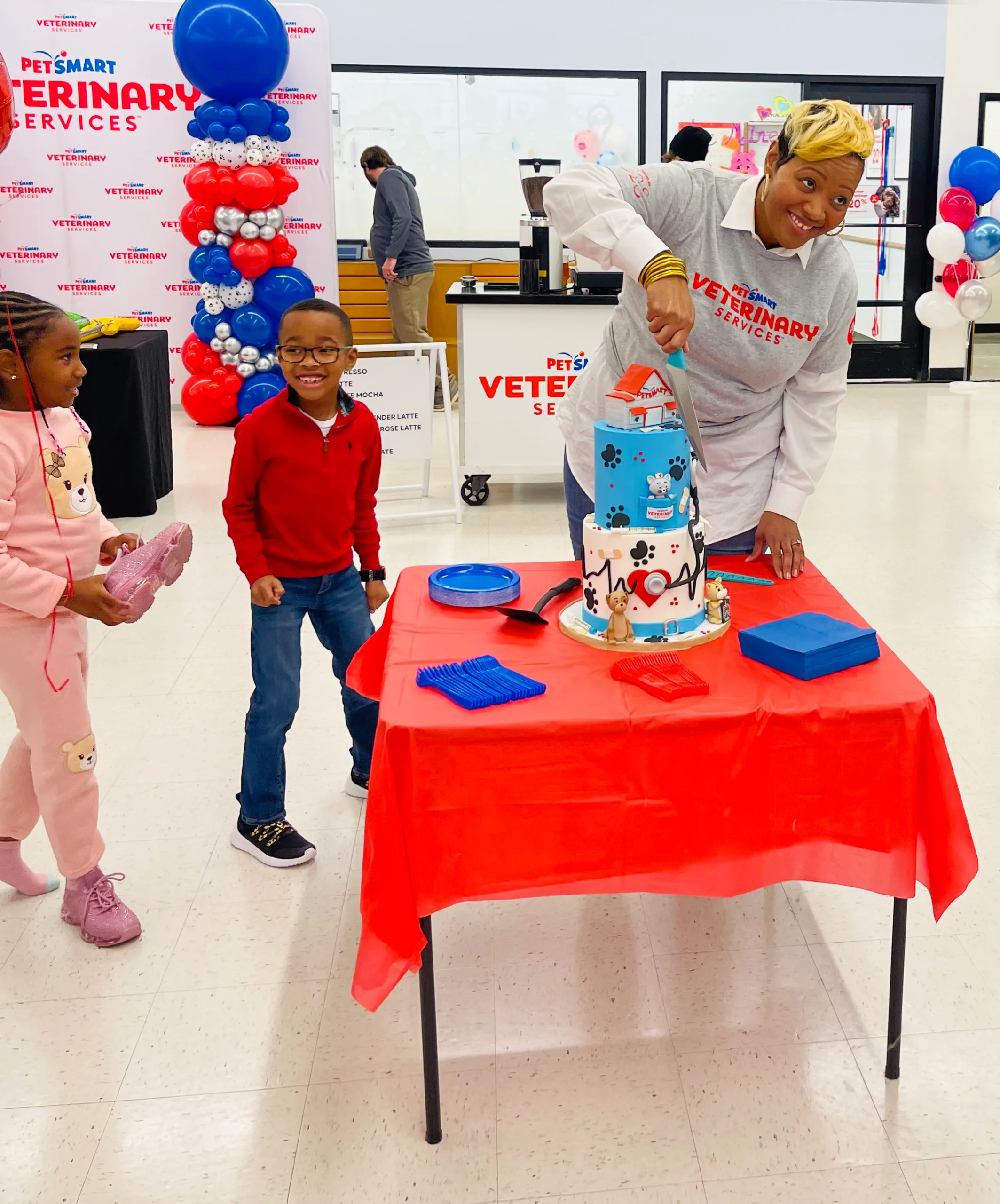 Cutting the grand opening cake