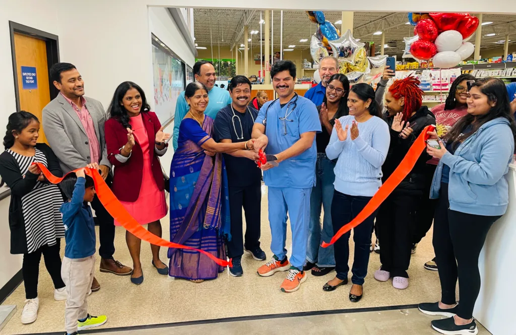Team cutting the ribbon for grand opening